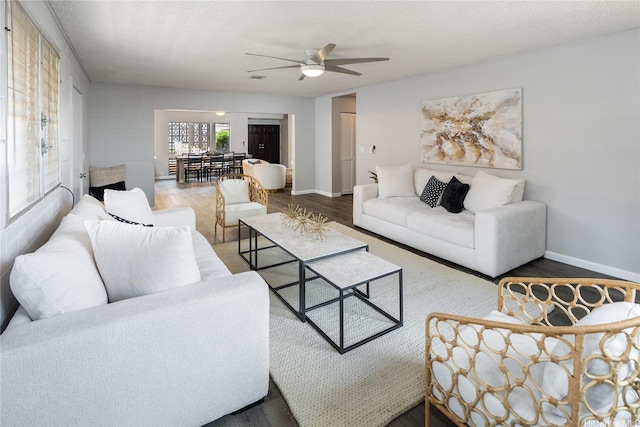 94-313 Ulukoa St, Mililani, HI 96789 - living area with wood finished floors, a ceiling fan, and baseboards