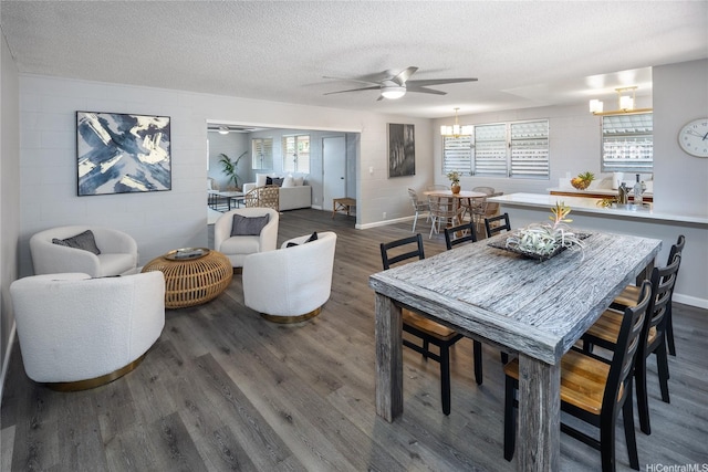 94-313 Ulukoa St, Mililani, HI 96789 - dining room featuring a ceiling fan, a textured ceiling, dark wood-style floors, baseboards, and a chandelier