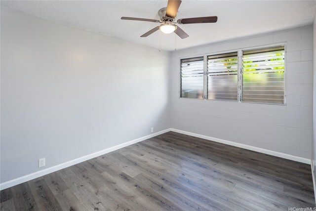 94-313 Ulukoa St, Mililani, HI 96789 - empty room featuring wood finished floors, ceiling fan, and baseboards