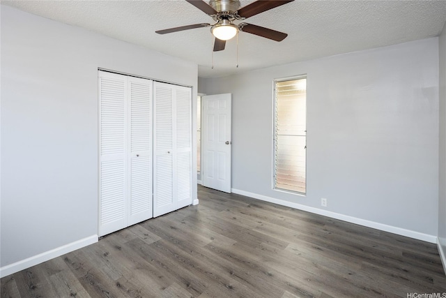 94-313 Ulukoa St, Mililani, HI 96789 - unfurnished bedroom with wood finished floors, baseboards, a closet, and ceiling fan