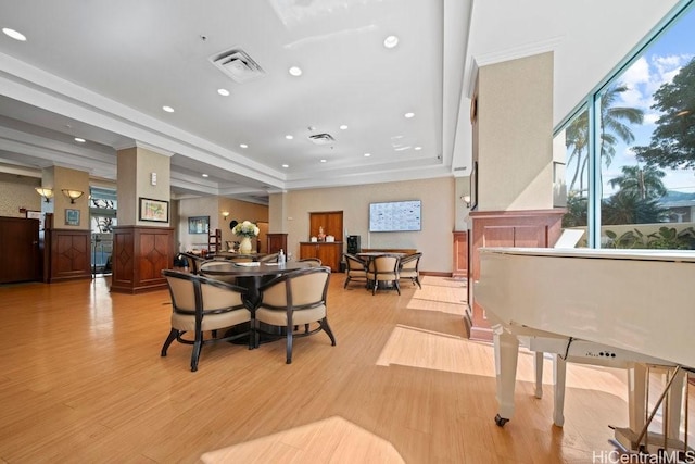 1314 Kalakaua Ave Unit 906, Honolulu, HI 96826 - dining area with light wood-style flooring, ornamental molding, recessed lighting, and a raised ceiling
