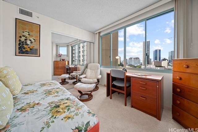 1314 Kalakaua Ave Unit 906, Honolulu, HI 96826 - bedroom with light carpet, a skyline view, a textured ceiling, and an office area