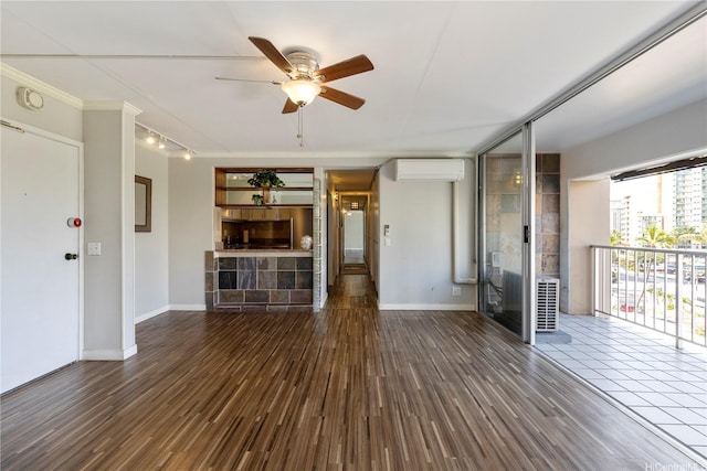 430 Keoniana St Unit 204, Honolulu, HI 96815 - unfurnished living room with baseboards, an AC wall unit, ceiling fan, wood finished floors, and rail lighting