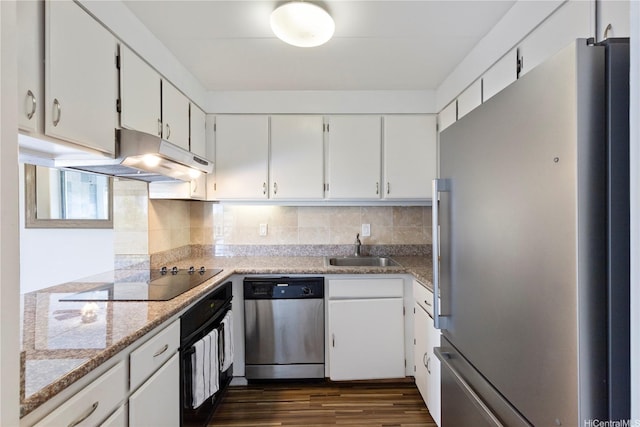 430 Keoniana St Unit 204, Honolulu, HI 96815 - kitchen featuring dark wood-style flooring, white cabinetry, under cabinet range hood, stainless steel appliances, and a sink