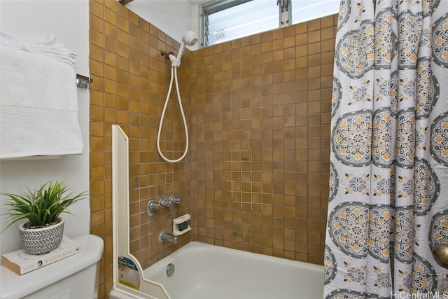 full bath with toilet and shower / tub combo with curtain