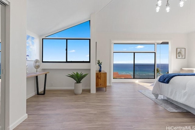 1782 Laukahi St, Honolulu, HI 96821 - bedroom with lofted ceiling, wood finished floors, a water view, and multiple windows