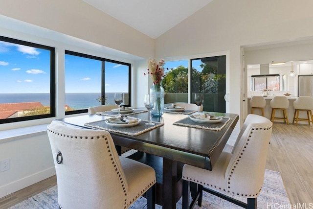 1782 Laukahi St, Honolulu, HI 96821 - dining space with light wood-style floors, baseboards, and high vaulted ceiling