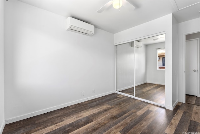 91-241 Makalauna Pl Unit 15, Ewa Beach, HI 96706 - unfurnished bedroom with a wall mounted air conditioner, wood finished floors, a closet, and ceiling fan