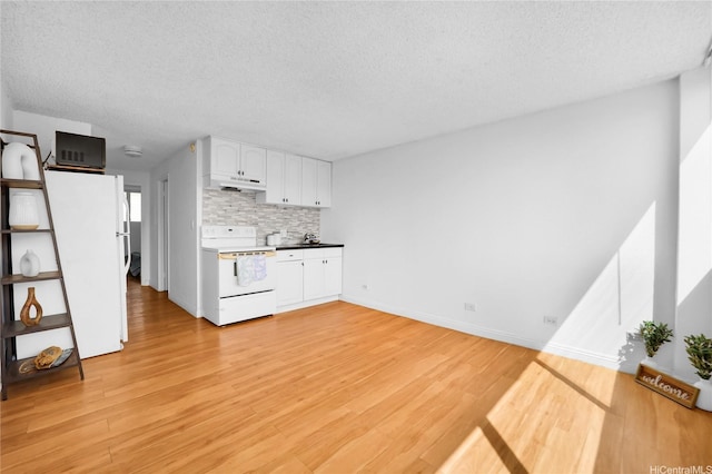 2211 Ala Wai Blvd Unit 1106, Honolulu, HI 96815 - kitchen featuring white appliances, under cabinet range hood, a textured ceiling, backsplash, and white cabinetry