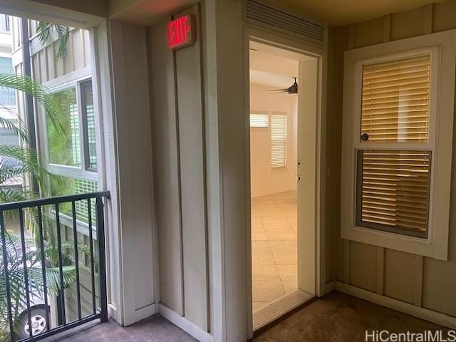 exterior space with a ceiling fan and plenty of natural light