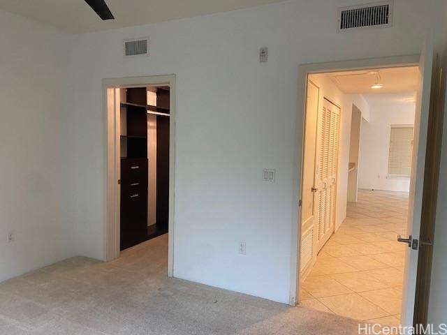 unfurnished bedroom with visible vents