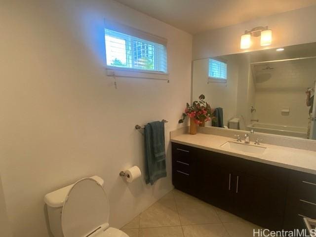 bathroom featuring toilet, washtub / shower combination, vanity, and tile patterned floors