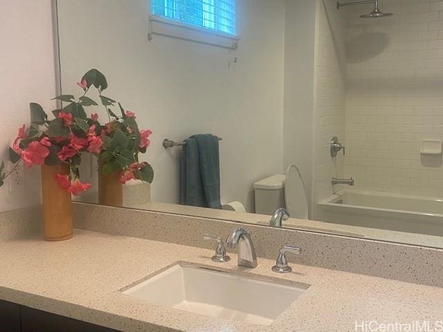 full bath with vanity, shower / tub combination, and toilet