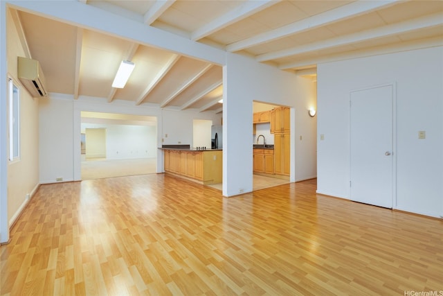 99-611 Alia Pl, Aiea, HI 96701 - unfurnished living room featuring a sink, an AC wall unit, light wood-style floors, and lofted ceiling with beams