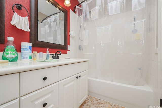 bathroom featuring vanity and shower / bathtub combination with curtain