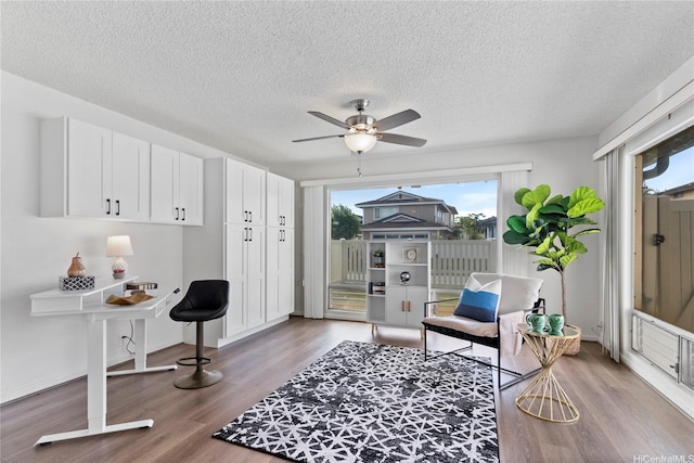 94-1041 Puana St, Waipahu, HI 96797 - living area featuring plenty of natural light, ceiling fan, a textured ceiling, wood finished floors, and baseboards