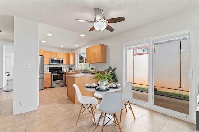 94-1041 Puana St, Waipahu, HI 96797 - dining space featuring ceiling fan, light tile patterned floors, recessed lighting, and a textured ceiling