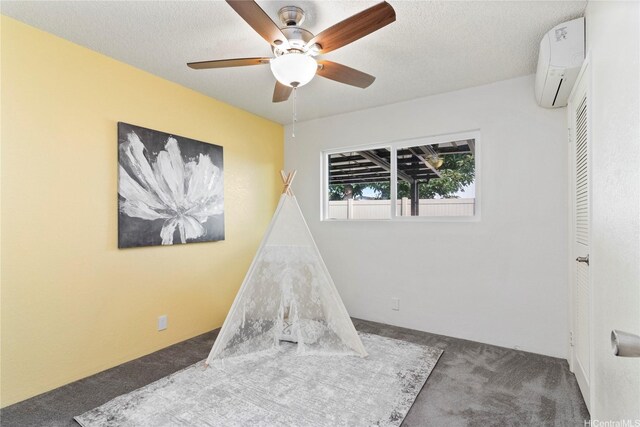 94-1041 Puana St, Waipahu, HI 96797 - rec room featuring carpet flooring, a wall unit AC, ceiling fan, and a textured ceiling