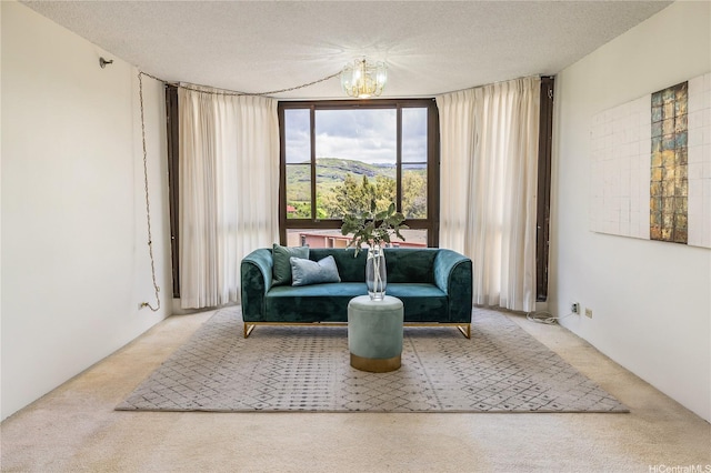 5090 Likini St Unit 501, Honolulu, HI 96818 - living area with carpet, a chandelier, and a textured ceiling