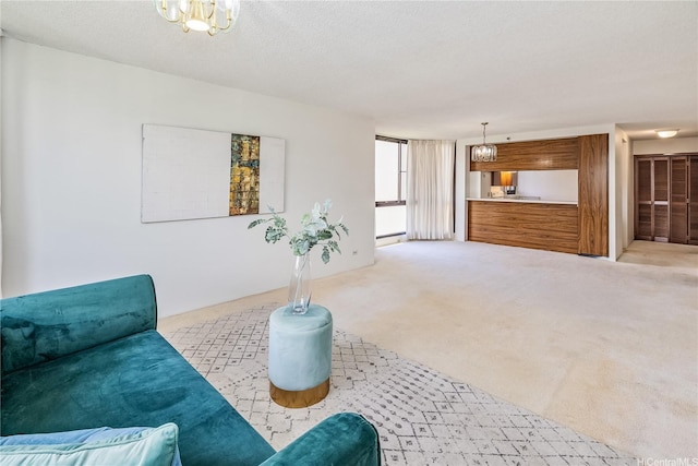 5090 Likini St Unit 501, Honolulu, HI 96818 - living area with a chandelier and carpet flooring