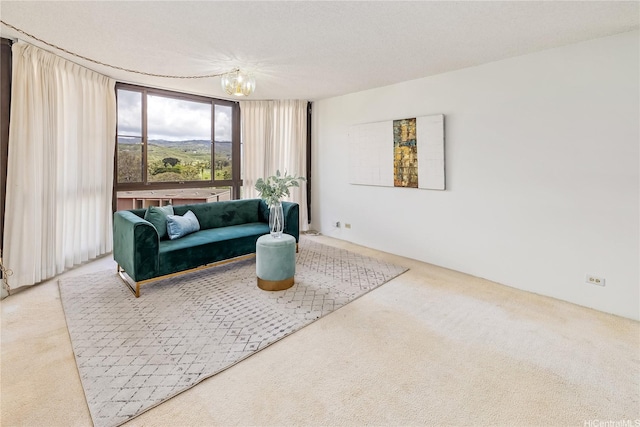 5090 Likini St Unit 501, Honolulu, HI 96818 - living area featuring carpet and a chandelier