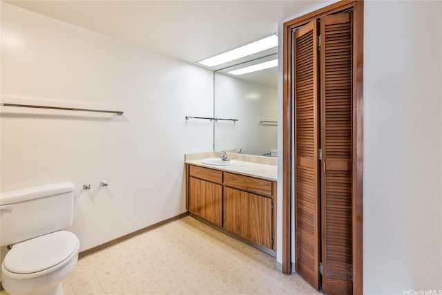 5090 Likini St Unit 501, Honolulu, HI 96818 - bathroom featuring a closet, tile patterned floors, toilet, vanity, and baseboards