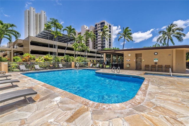 5090 Likini St Unit 501, Honolulu, HI 96818 - community pool featuring a patio area and fence