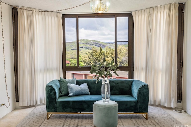 5090 Likini St Unit 501, Honolulu, HI 96818 - living area with carpet, a mountain view, and a chandelier