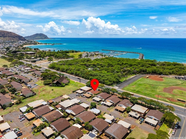 drone / aerial view featuring a water view and a residential view
