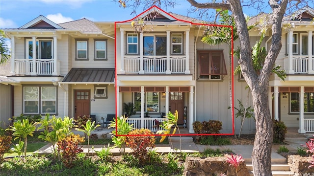 91-1322 Keoneula Blvd Unit 403, Ewa Beach, HI 96706 - multi unit property with a porch, a balcony, a standing seam roof, metal roof, and board and batten siding