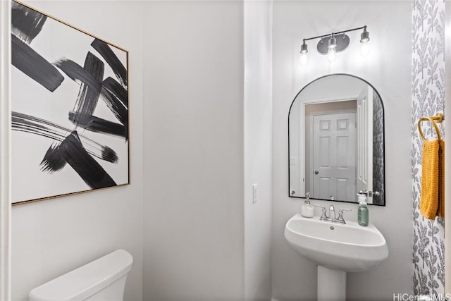 bathroom featuring a sink and toilet