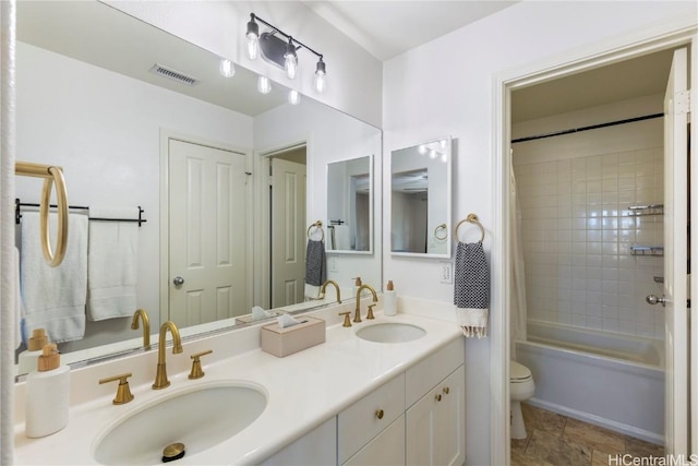 full bathroom featuring shower / tub combo, visible vents, a sink, and toilet