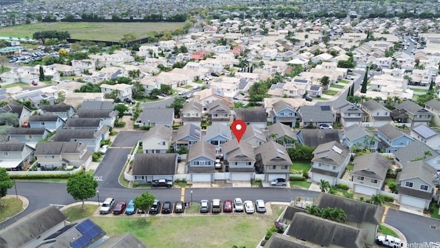 birds eye view of property with a residential view