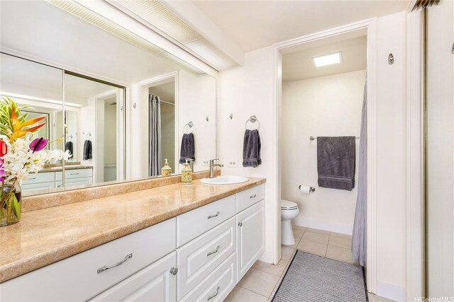 1022 Prospect St Unit 704A, Honolulu, HI 96822 - full bath with tile patterned floors, vanity, toilet, and baseboards