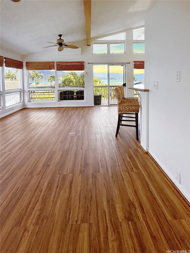 44-313 Kaneohe Bay Dr Unit B, Kaneohe, HI 96744 - unfurnished living room featuring a ceiling fan, baseboards, wood finished floors, and lofted ceiling