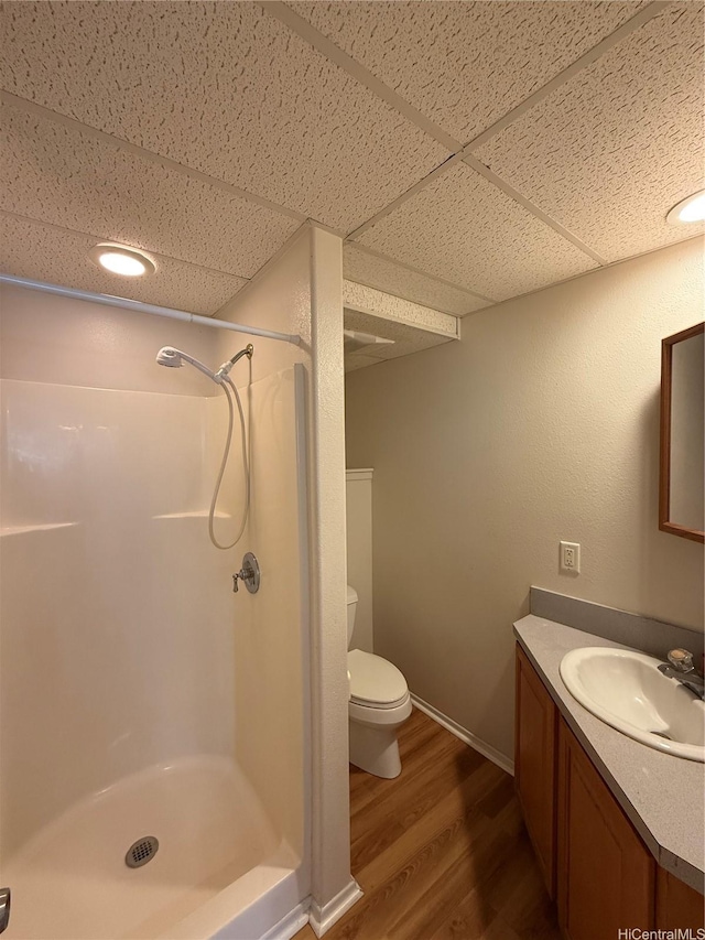 44-313 Kaneohe Bay Dr Unit B, Kaneohe, HI 96744 - full bath featuring a drop ceiling, a stall shower, wood finished floors, vanity, and toilet