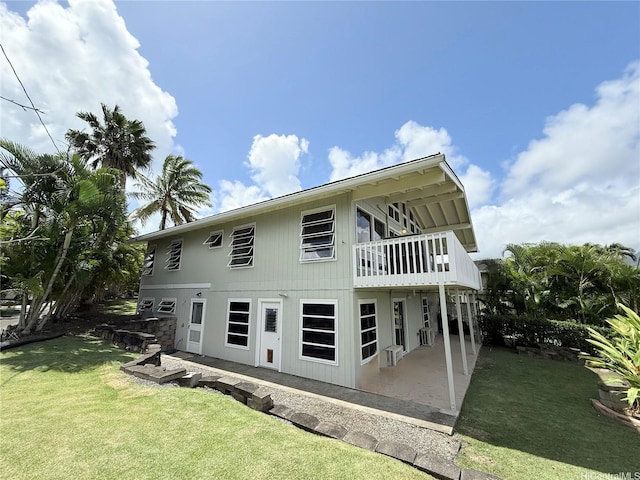 44-313 Kaneohe Bay Dr Unit B, Kaneohe, HI 96744 - rear view of house with a lawn and a patio area