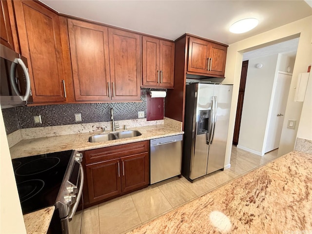 521 Hahaione St Unit 2-15L, Honolulu, HI 96825 - kitchen with appliances with stainless steel finishes, a sink, light stone countertops, and decorative backsplash