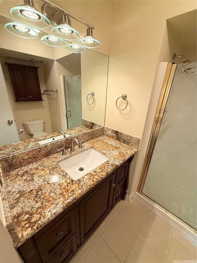 521 Hahaione St Unit 2-15L, Honolulu, HI 96825 - full bath featuring a stall shower, tile patterned floors, toilet, and vanity
