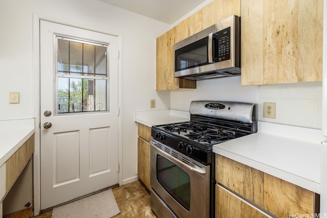94-1199 Meleinoa Pl Unit 21C, Waipahu, HI 96797 - kitchen with light countertops and stainless steel appliances