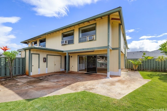 94-1199 Meleinoa Pl Unit 21C, Waipahu, HI 96797 - view of front of property featuring a fenced backyard, a front lawn, a patio area, and cooling unit
