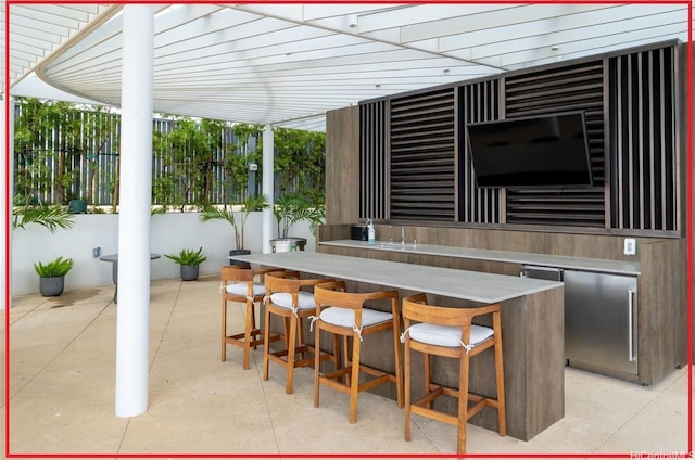 view of patio / terrace with exterior bar