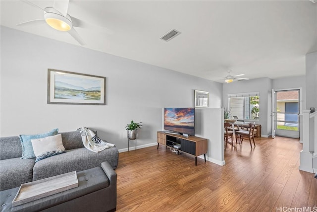 91-1200 Kaileolea Dr Unit 2K2, Ewa Beach, HI 96706 - living room featuring visible vents, baseboards, a ceiling fan, and wood finished floors