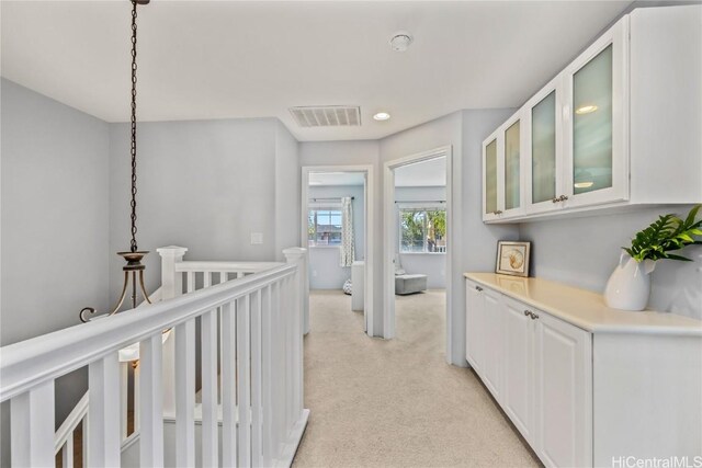 91-1200 Kaileolea Dr Unit 2K2, Ewa Beach, HI 96706 - hall with light carpet, an upstairs landing, and visible vents