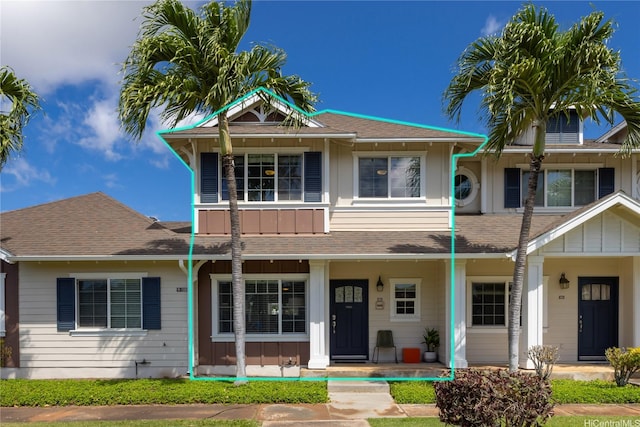 91-1200 Kaileolea Dr Unit 2K2, Ewa Beach, HI 96706 - view of front of house with board and batten siding, a porch, and a shingled roof