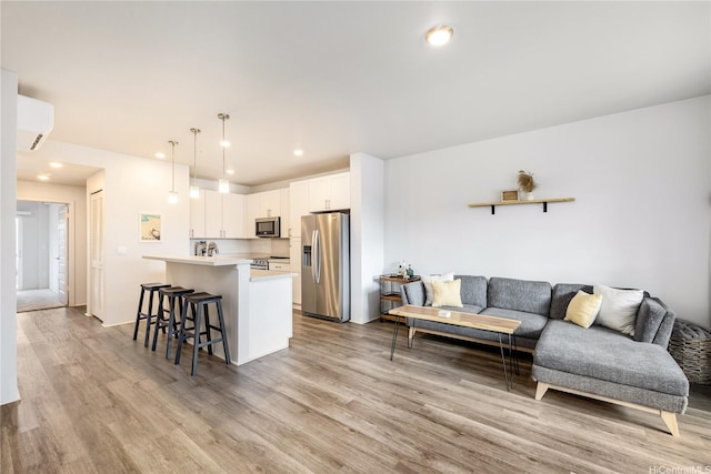 91-3525 Kauluakoko St Unit 2112, Ewa Beach, HI 96706 - living area featuring light wood-type flooring and recessed lighting