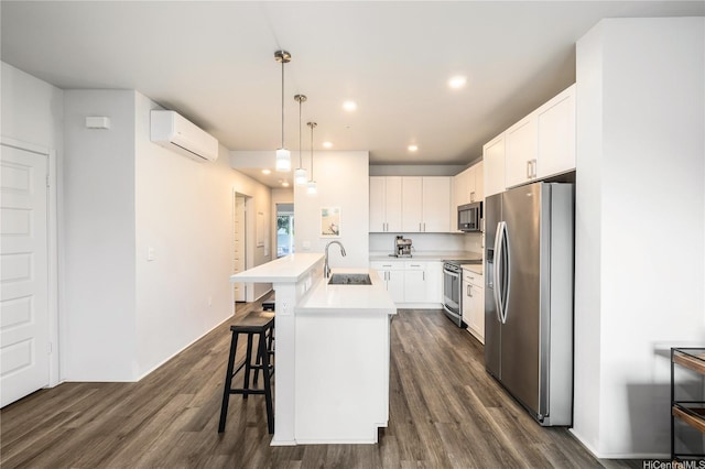91-3525 Kauluakoko St Unit 2112, Ewa Beach, HI 96706 - kitchen featuring stainless steel appliances, dark wood-type flooring, a wall unit AC, recessed lighting, and light countertops