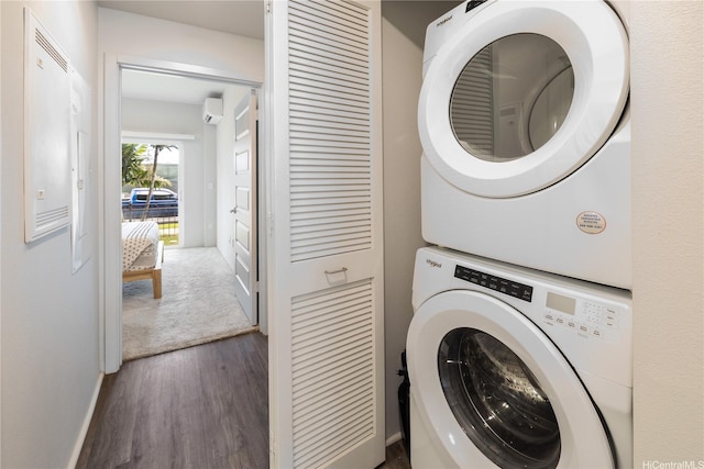 91-3525 Kauluakoko St Unit 2112, Ewa Beach, HI 96706 - washroom with estacked washer and dryer, wood finished floors, and an AC wall unit