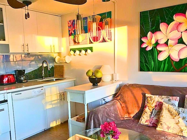 kitchen featuring dishwasher, a sink, tasteful backsplash, white cabinets, and glass insert cabinets