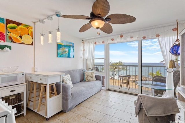 85-175 Farrington Hwy Unit A402, Waianae, HI 96792 - living room with a water view, light tile patterned floors, and ceiling fan